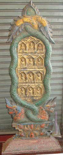 Votive plaque with Buddha images and naga Votive plaque with Buddha images and naga