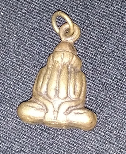 Closed eyed Buddha amulet Closed eyed Buddha amulet