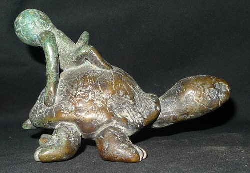 Fertility charm amulet on a turtle