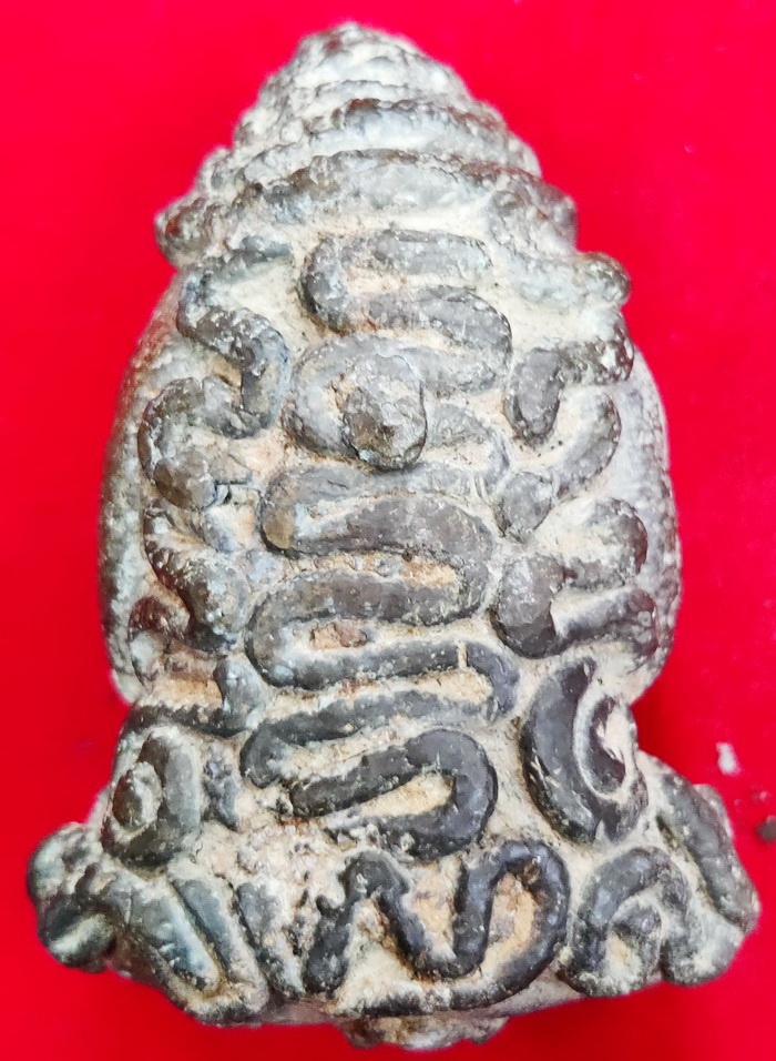Buddha face amulet