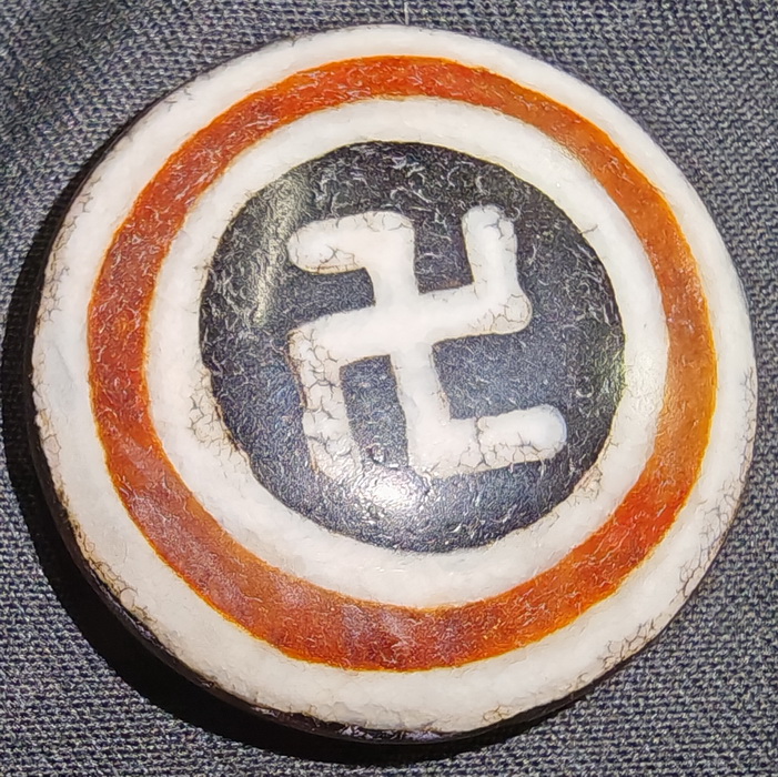 Swastika Bon pendant - reverse direction of Nazi symbol